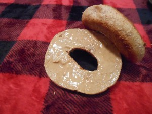 A whole wheat bagel with peanut butter is filled with good nutrients.