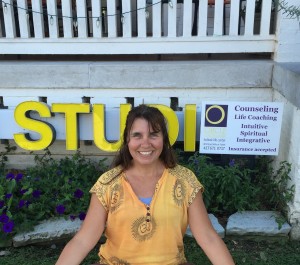 Candace Faith Fruge, manager and yoga instructor at Circle on the Square, sits in front of her studio.